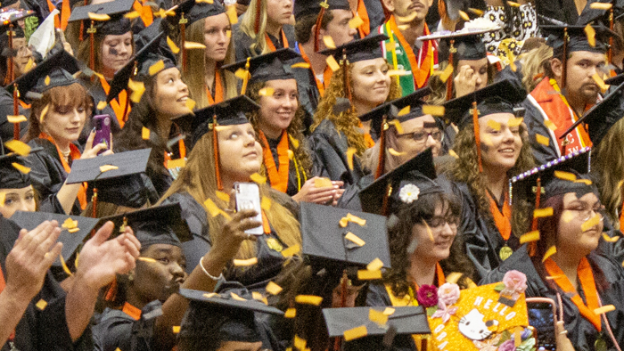 graduates at commencement