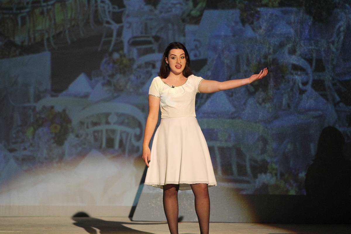 theatre student singing on stage