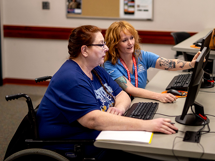 student with accessibilty support staff