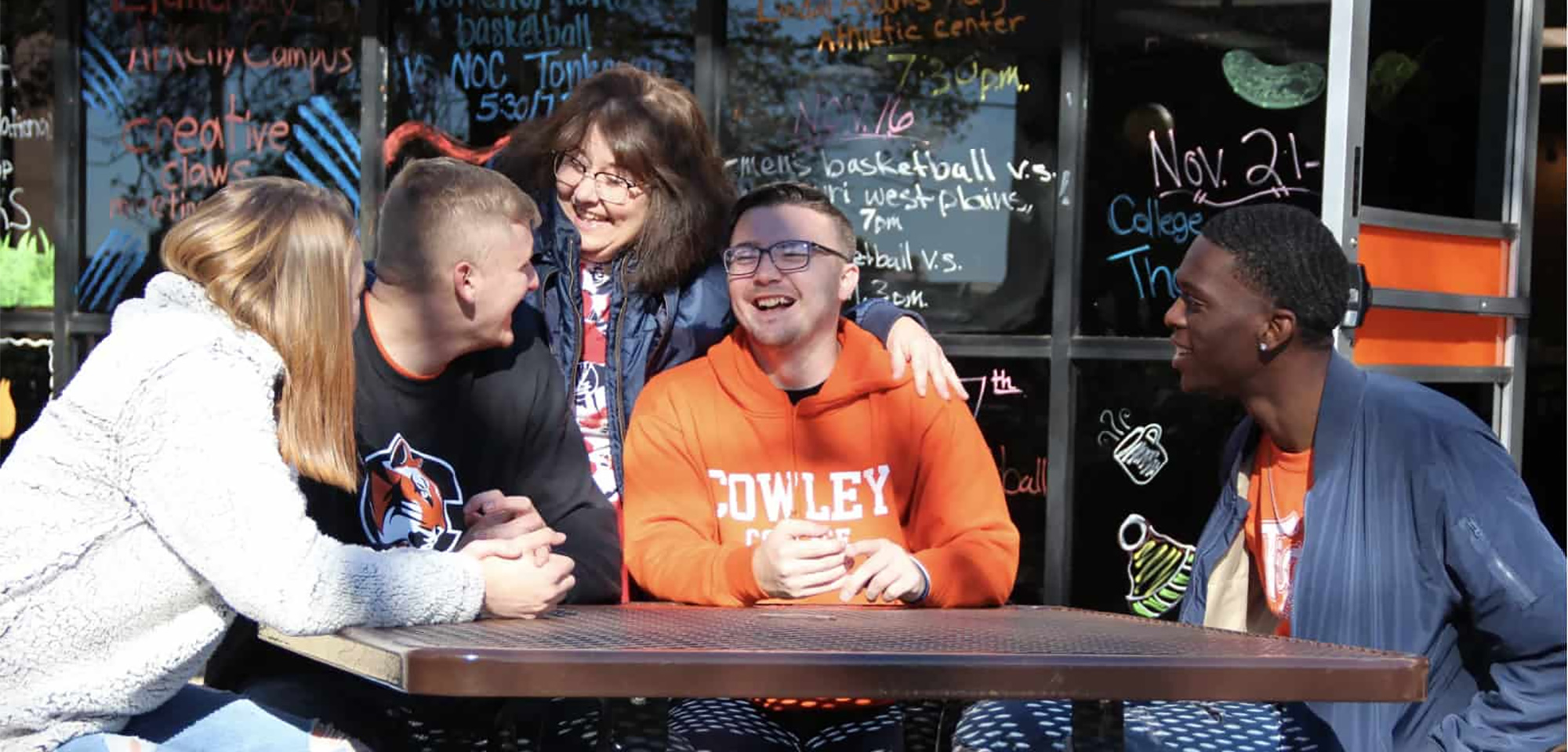 Cowley students sitting outside the student center