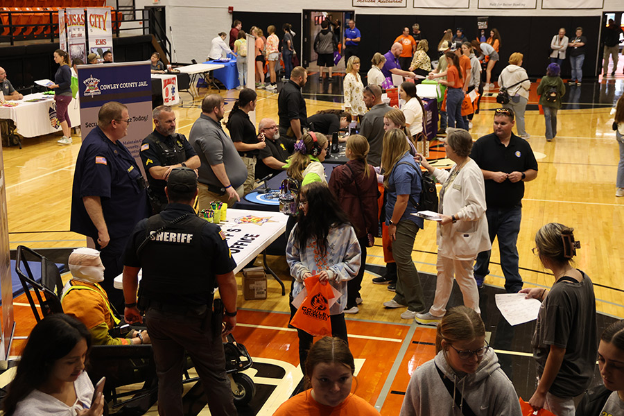 students at health services booths