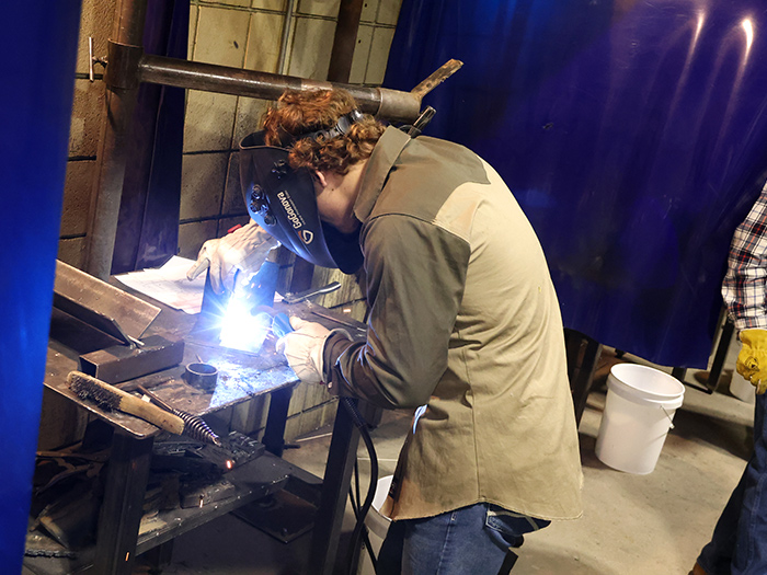 high school student at welding showdown