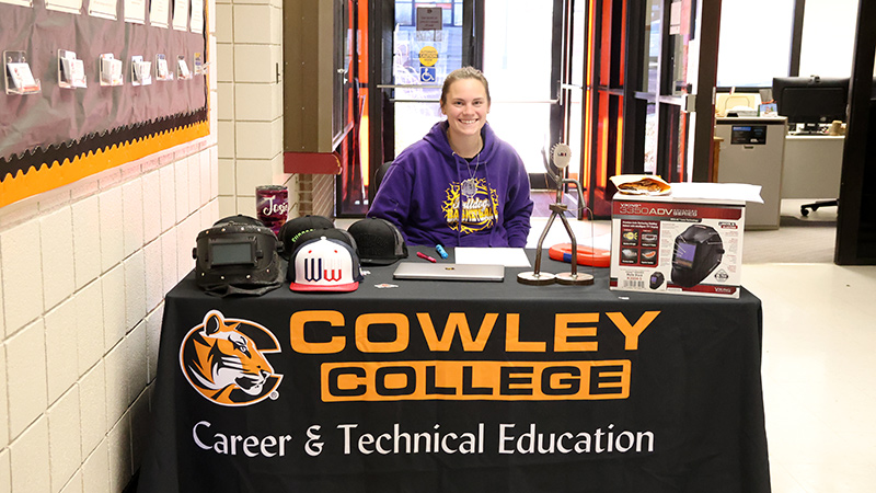 student at lobby desk