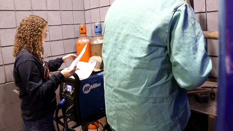 female student at welding showdown