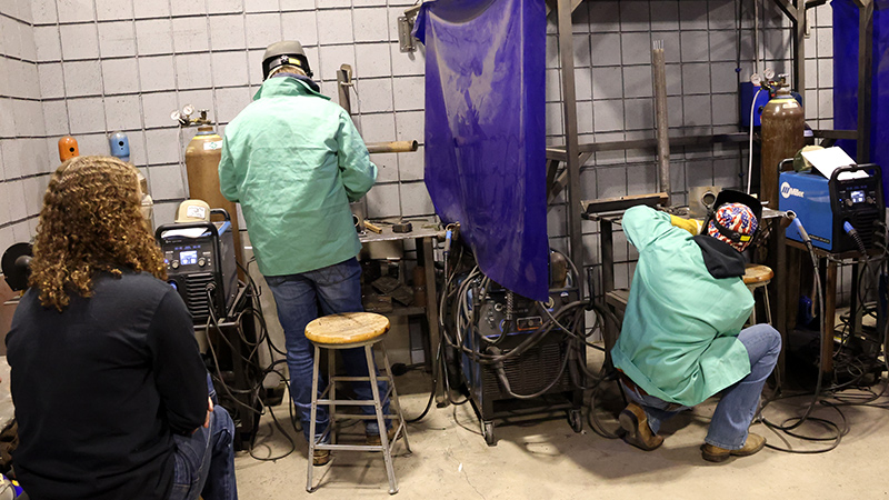 three high school students in the welding showdown