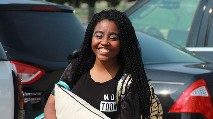female student moving into the dorms