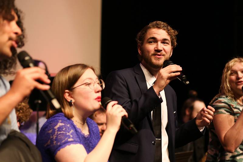 students singing on stage