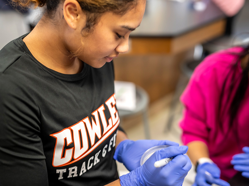 track athlete in a chemistry lab class at cowley college