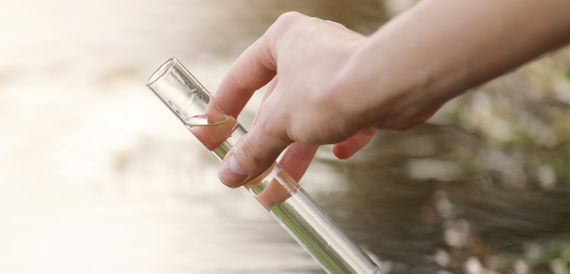 environmental scientist taking water sample