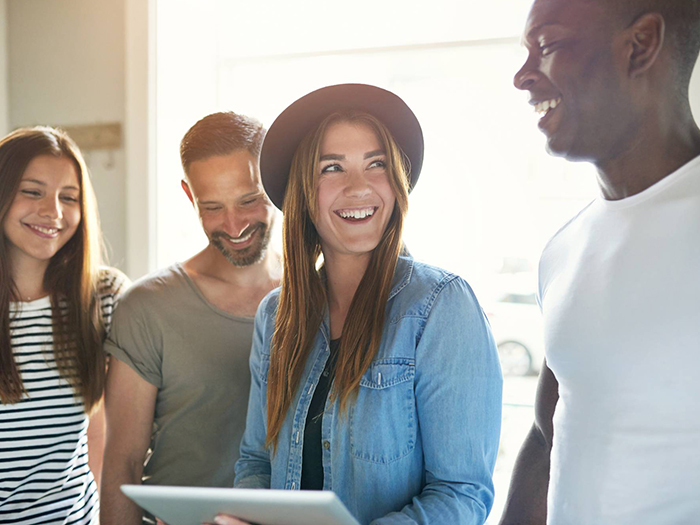 four people in a group discussing