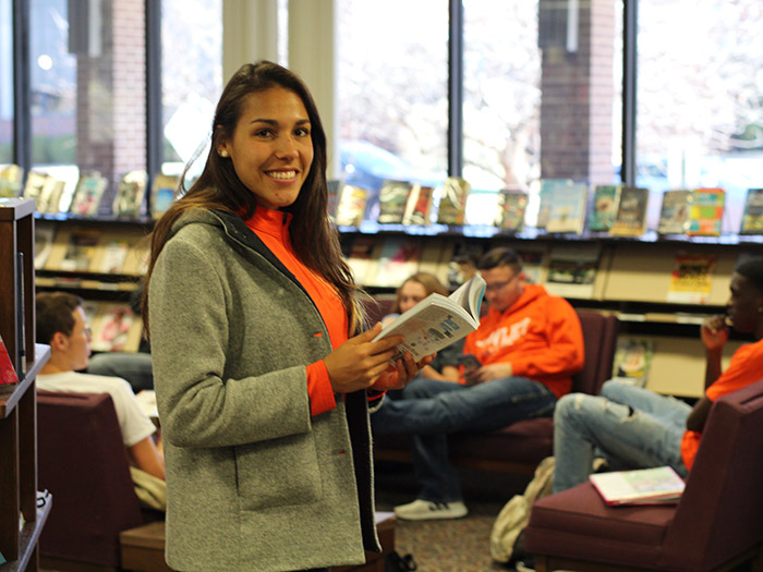 student in library