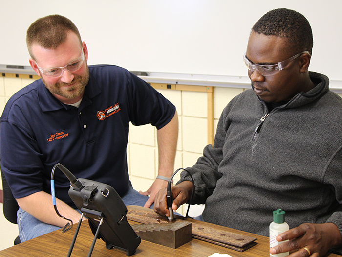 NDT student doing inspection