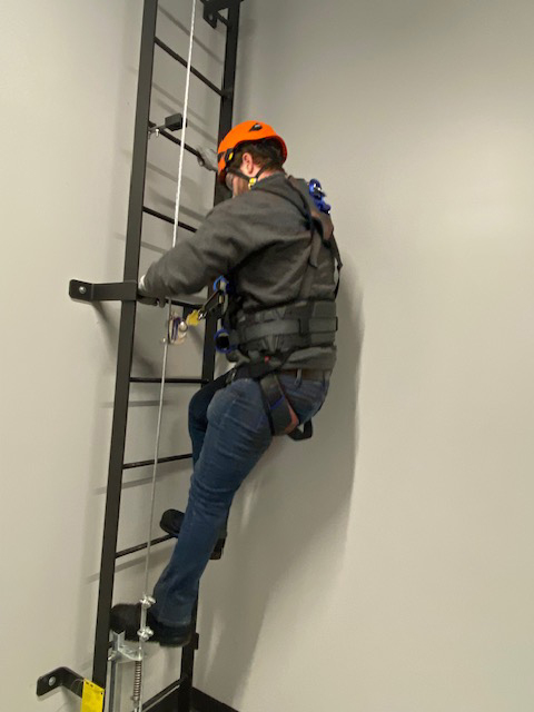 wind energy student in the middle of a climb test