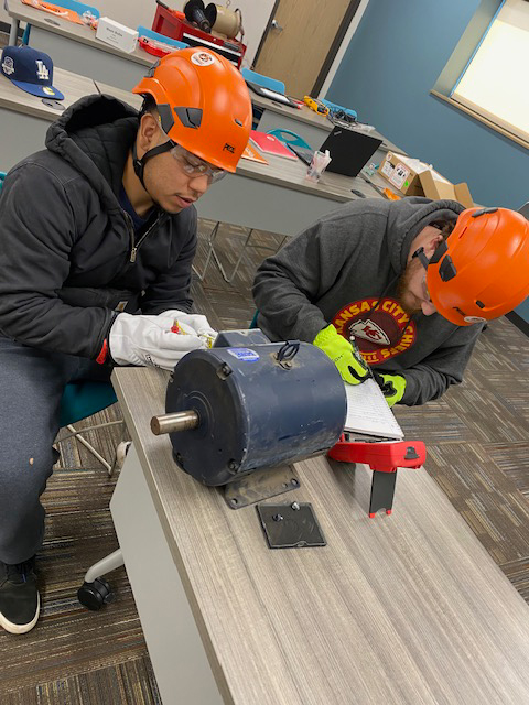 cowley college students testing a 3-phase motor